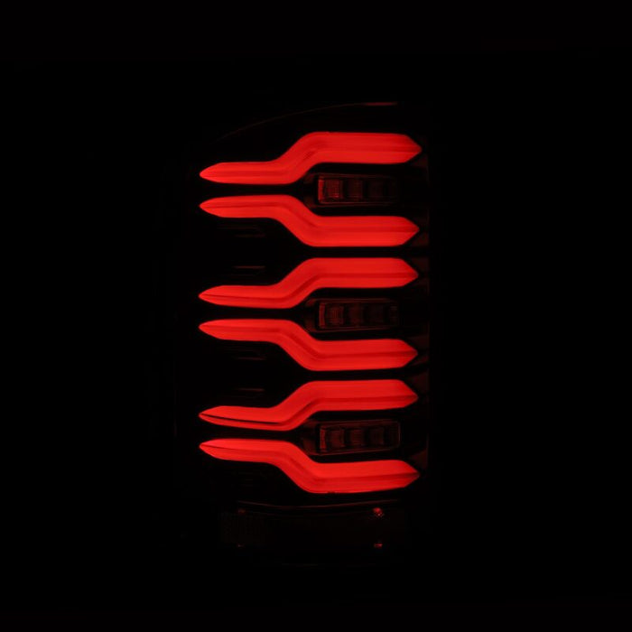AlphaRex 14-18 GMC Sierra 1500/2500HD/3500HD LUXX-Series LED Tail Lights Alpha-Blk Actv Lgt Seq. Sig