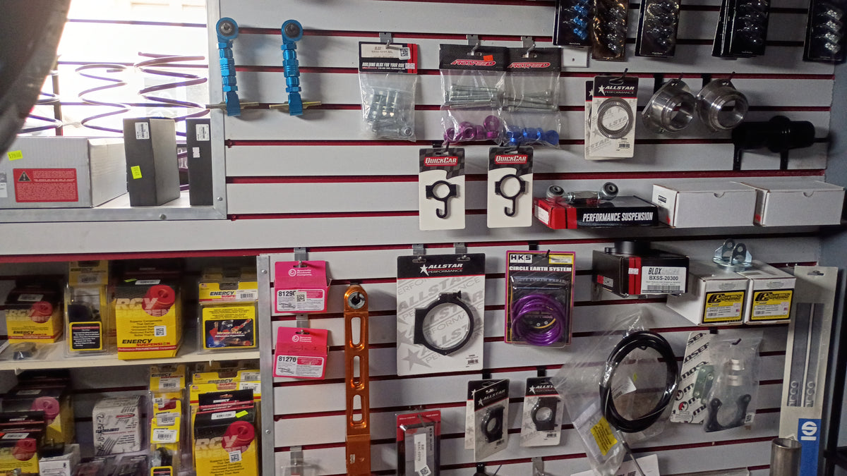 Shelving unit with automotive parts and tools in a store setting