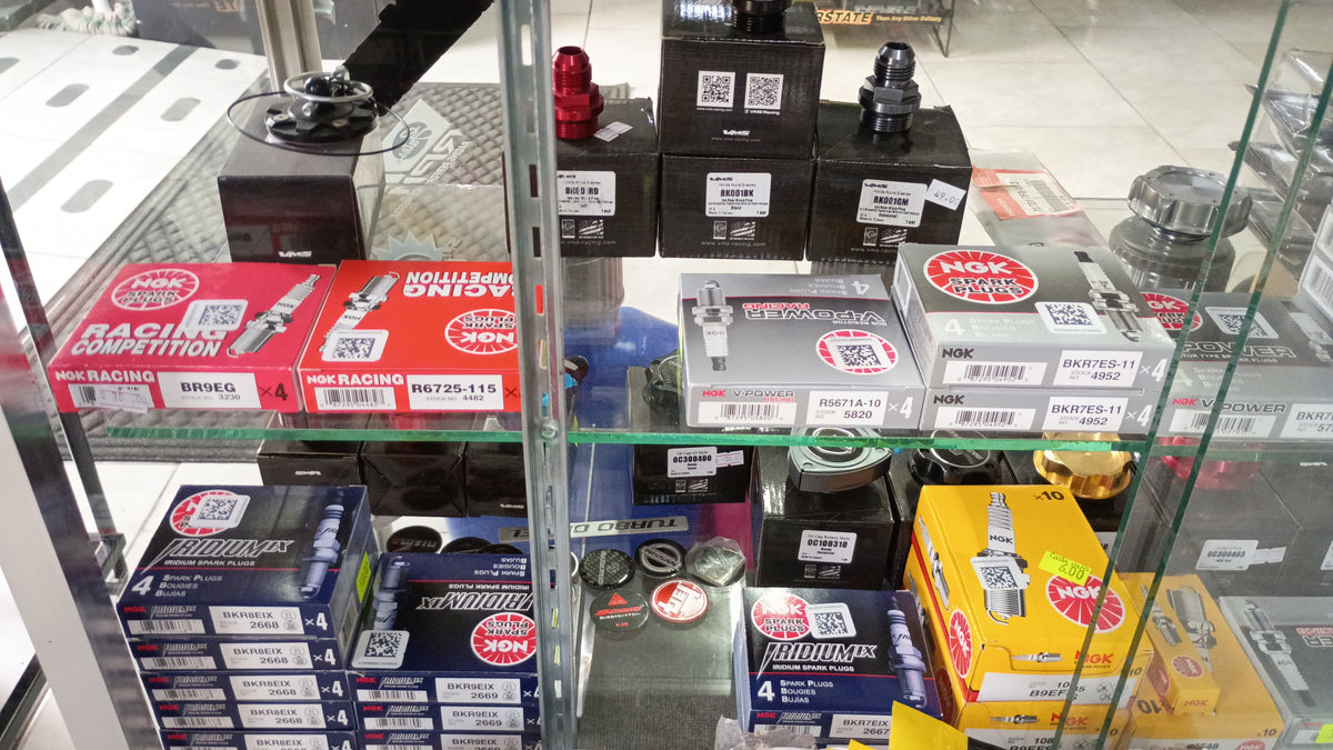 Display case with mostly spark plugs