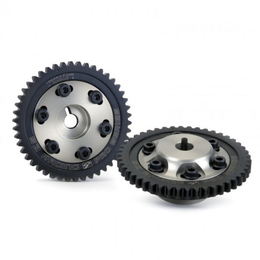 A pair of Skunk2 K Series Pro Series Cam Gears, one with a visible laser-etched timing mark and the other showing a six-bolt design, both in black.